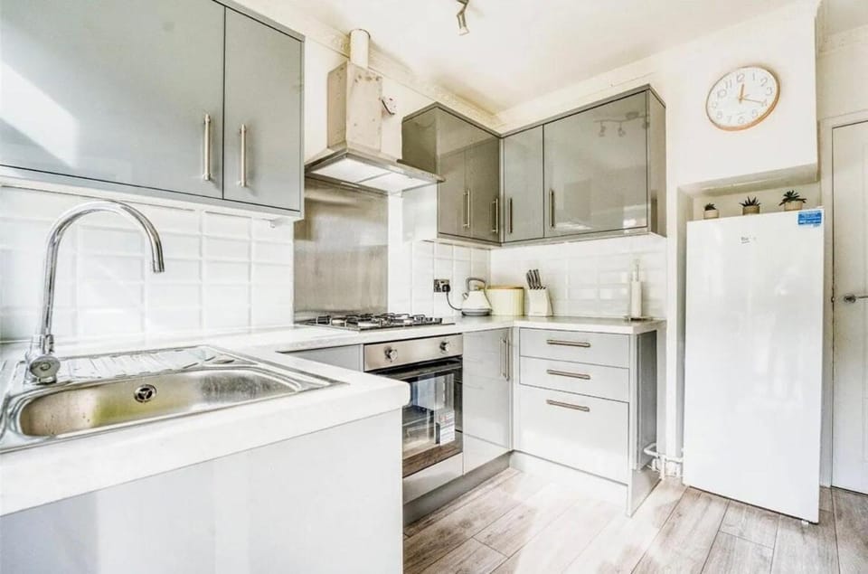 Kitchen or kitchenette, dishwasher, oven, stove