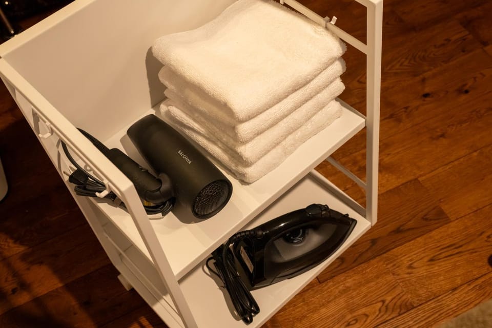 flat iron, hair dryier, towels