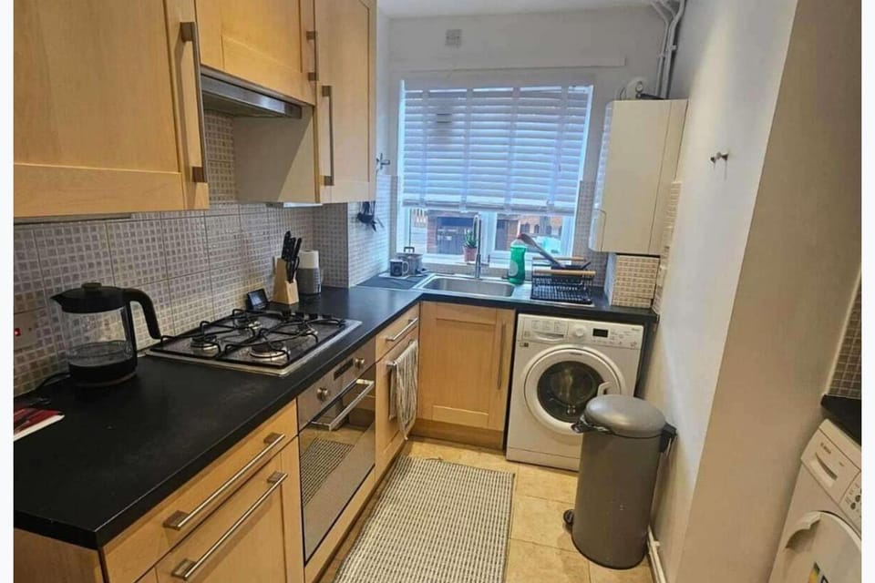 Kitchen or kitchenette, minibar, oven, stove, toaster, washing machine, dryer