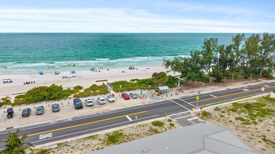 Beachview balconies with pool steps from the beach House in Bradenton Beach
