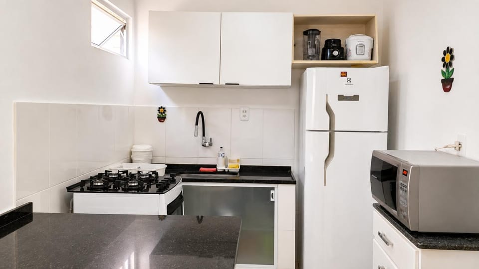 Kitchen or kitchenette, microwave, oven, stove