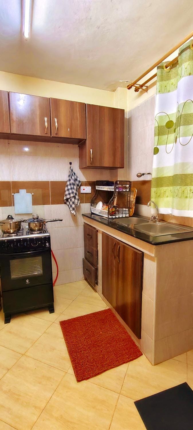 Kitchen or kitchenette, dishwasher, oven, stove