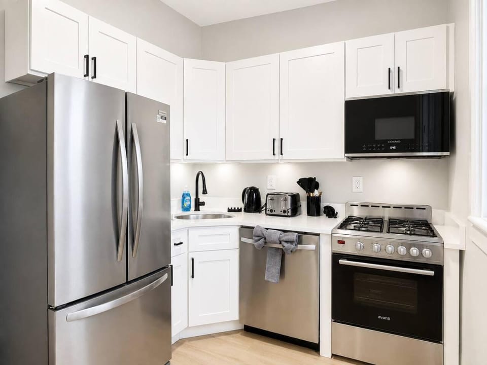 Kitchen or kitchenette, dishwasher, oven, stove, toaster