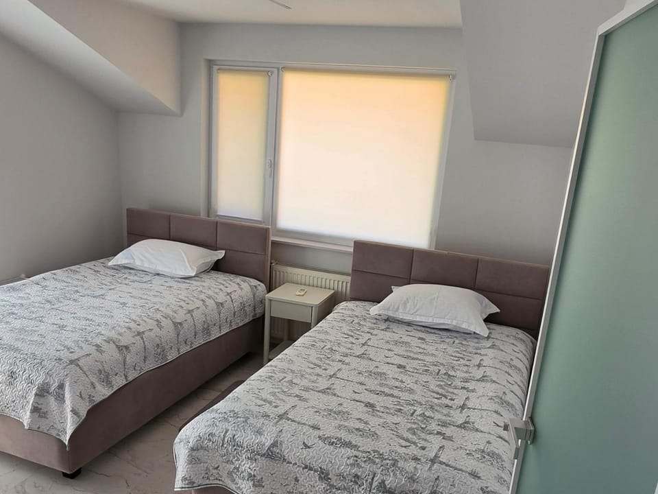 Cameră twin confortabilă și luminoasă Apartment in Bucharest