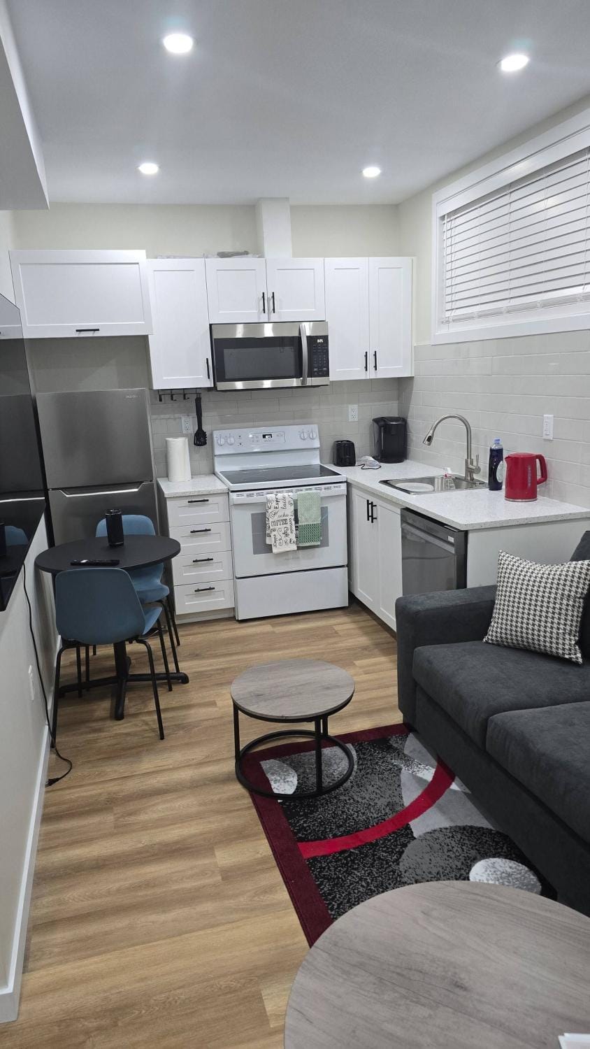 Living room, dishwasher, microwave, oven, kitchen