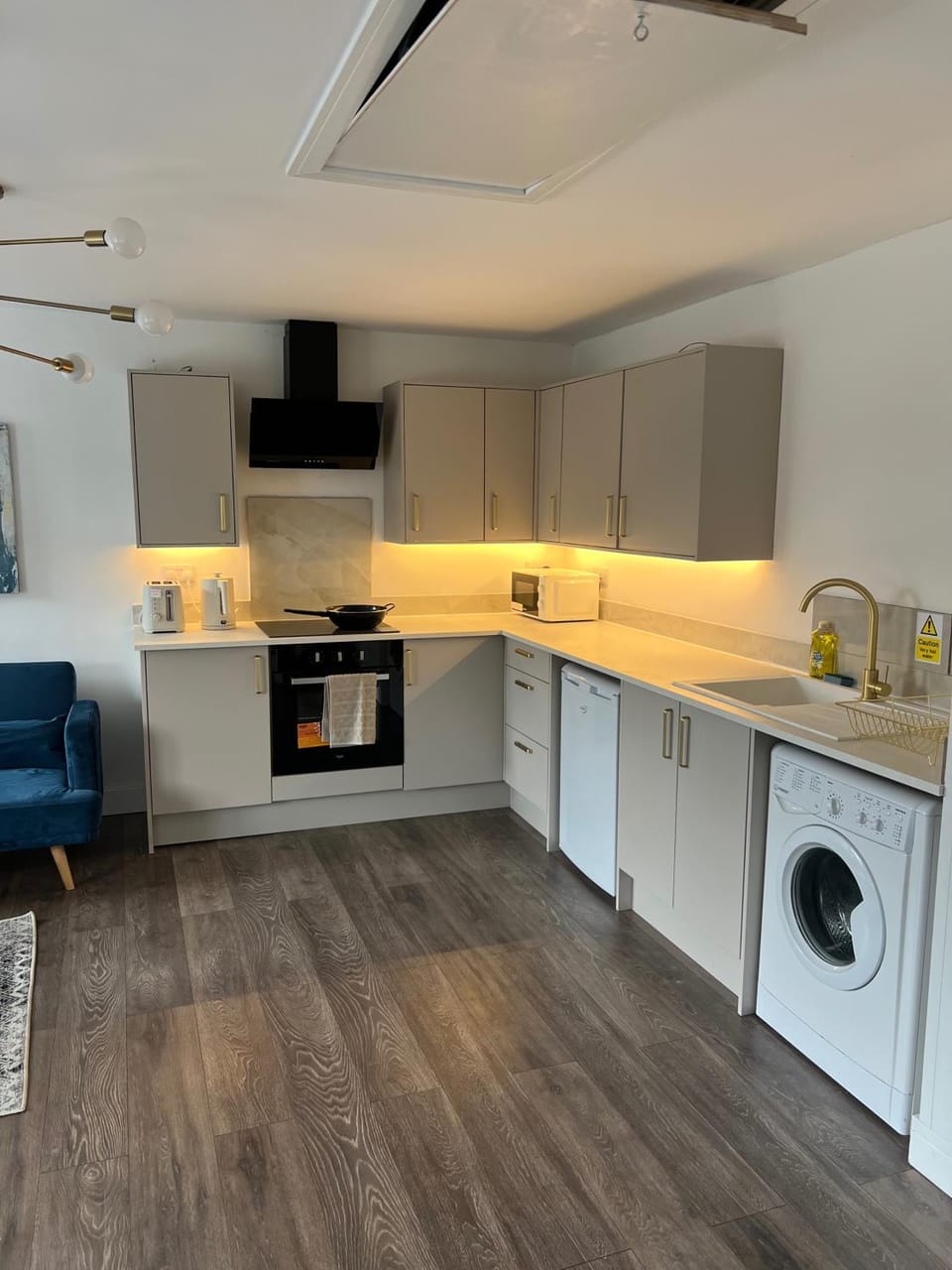 Kitchen or kitchenette, Living room, Seating area, furniture, oven, stove