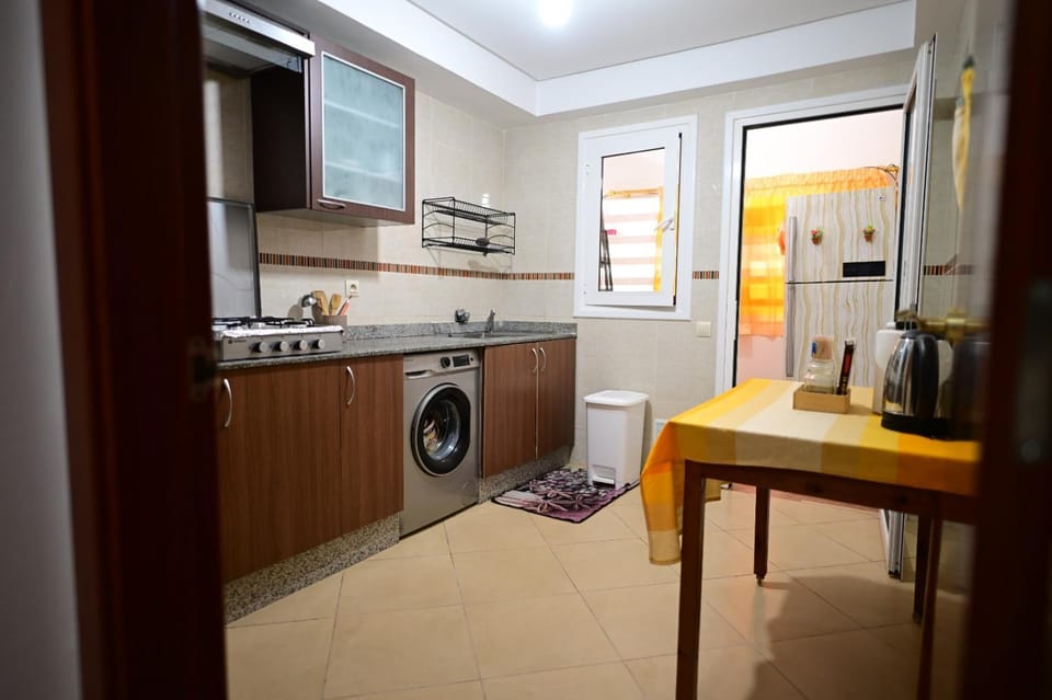 Kitchen or kitchenette, stove, washing machine
