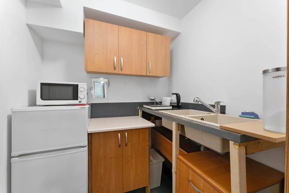 Kitchen or kitchenette, dishwasher, oven, stove