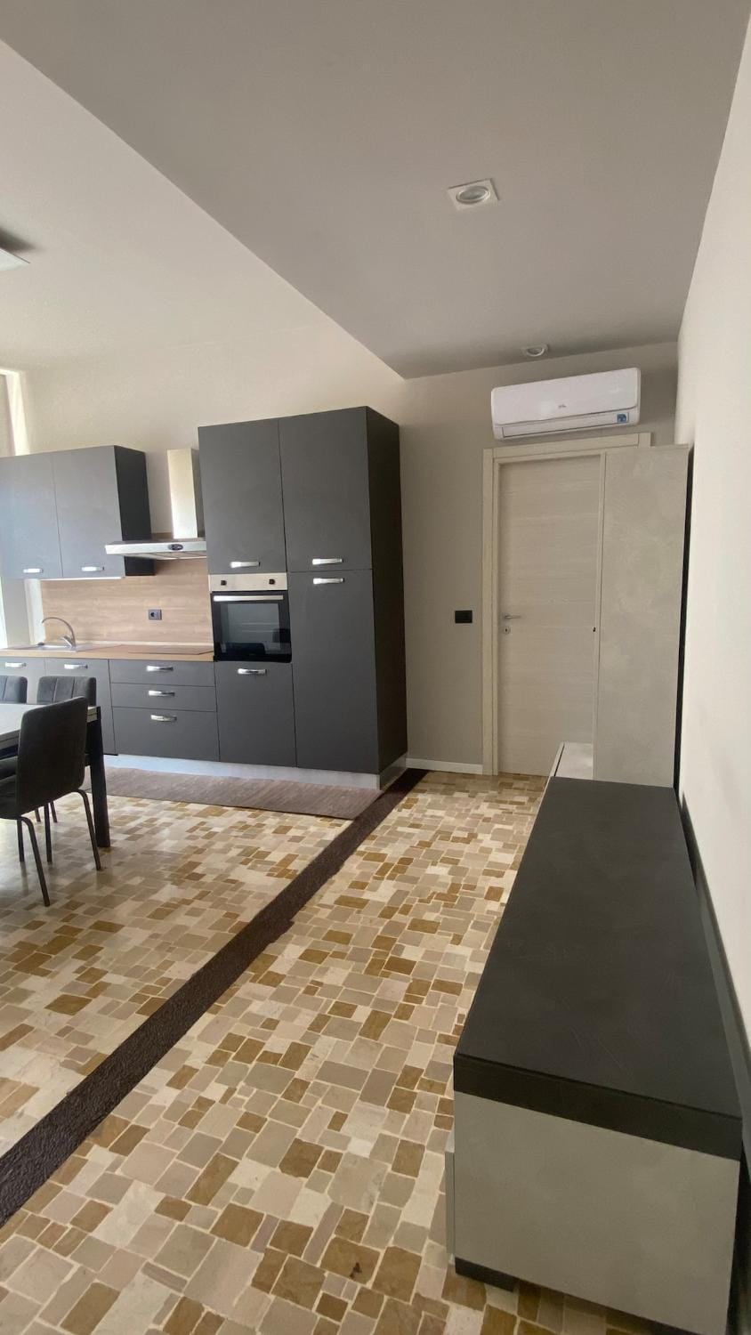 Kitchen or kitchenette, oven, stove, air conditioner