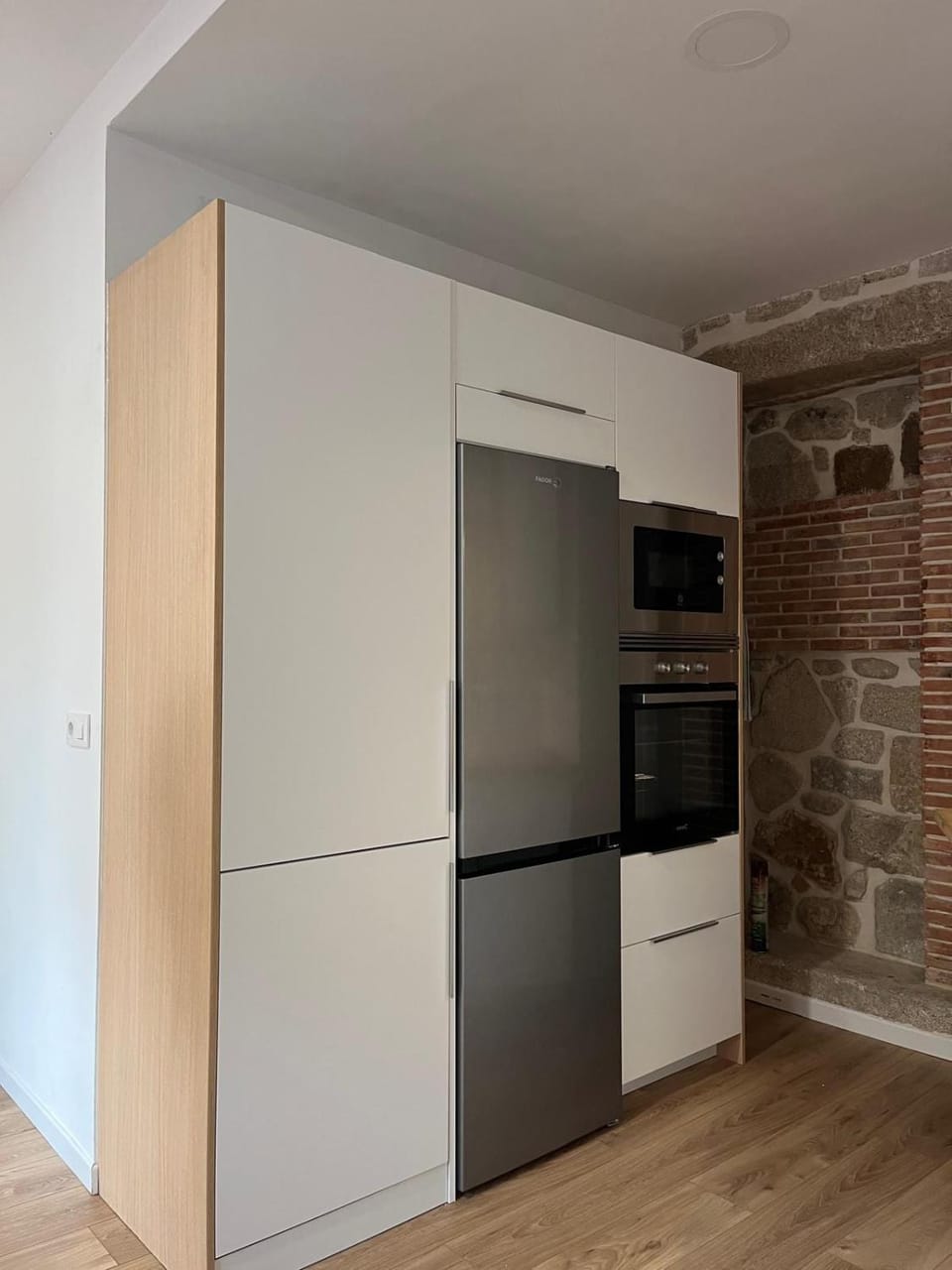 Kitchen or kitchenette, microwave, oven, washing machine, dryer