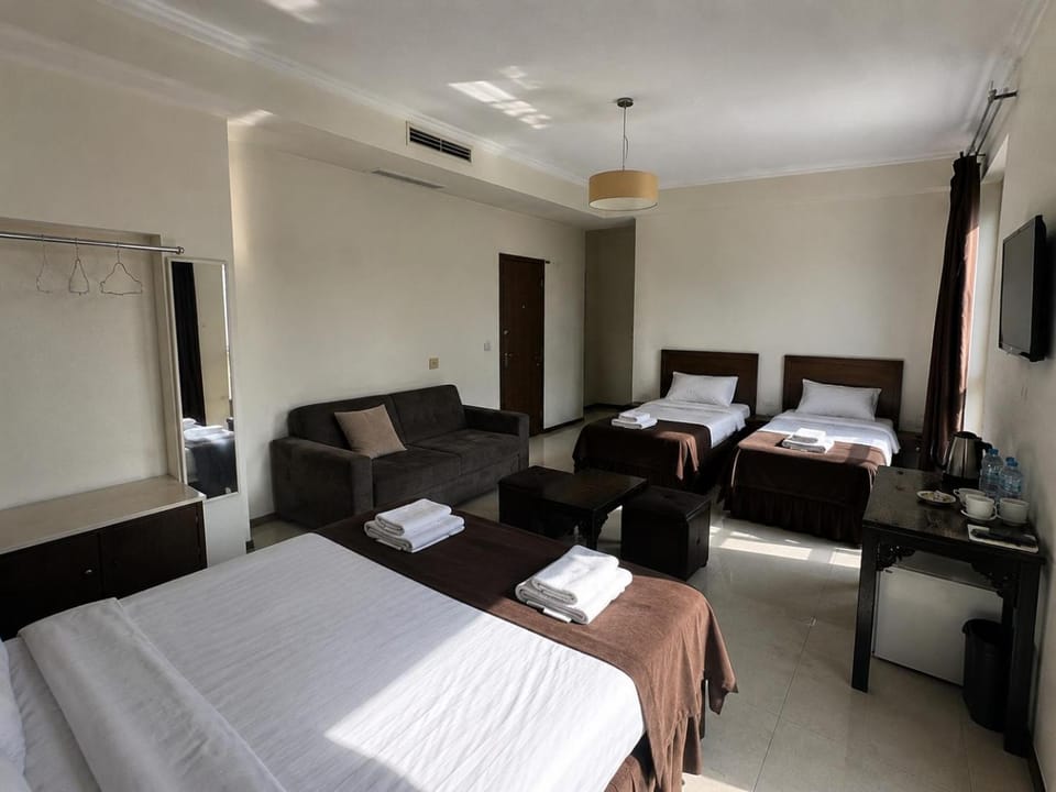 Bed, Living room, Photo of the whole room, Seating area, Bedroom, towels, air conditioner