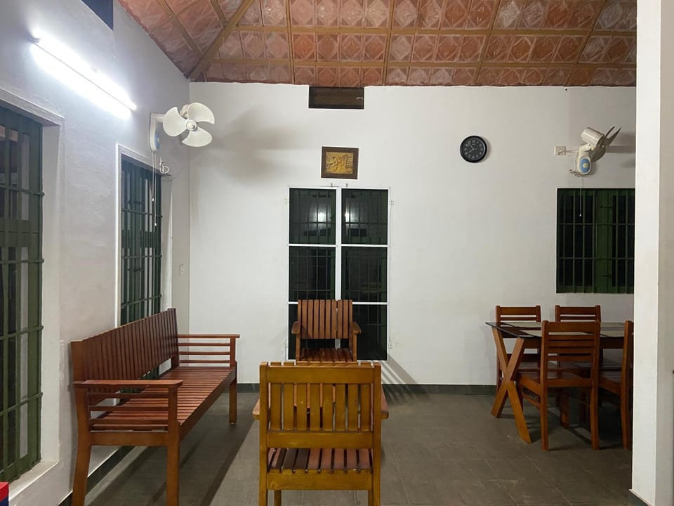 Solitude Riverside Red house House in Kerala