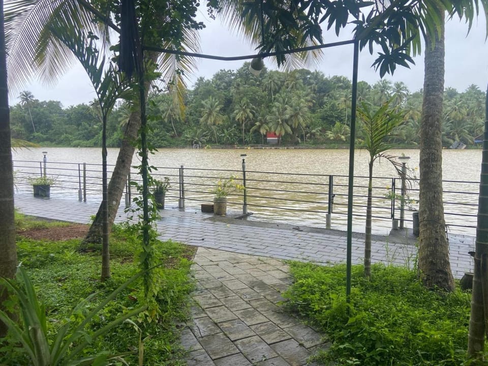 Solitude Riverside Red house House in Kerala