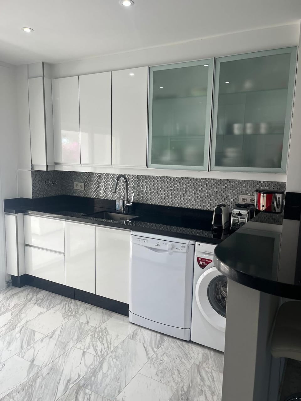 Kitchen or kitchenette, dishwasher, oven, stove