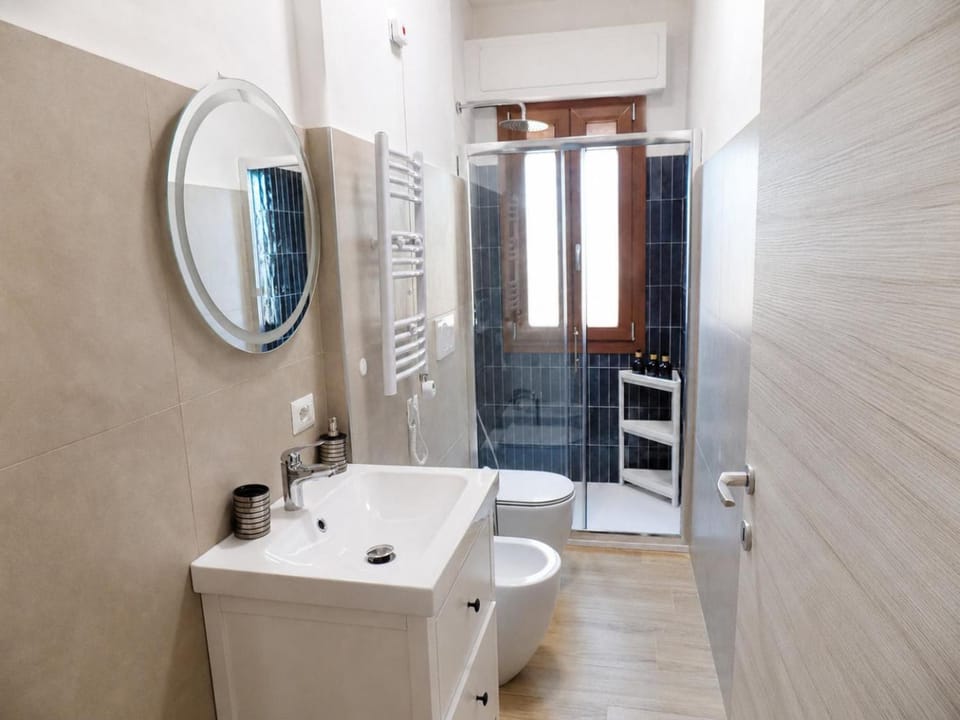 Shower, Toilet, Bathroom, hair dryier, towels