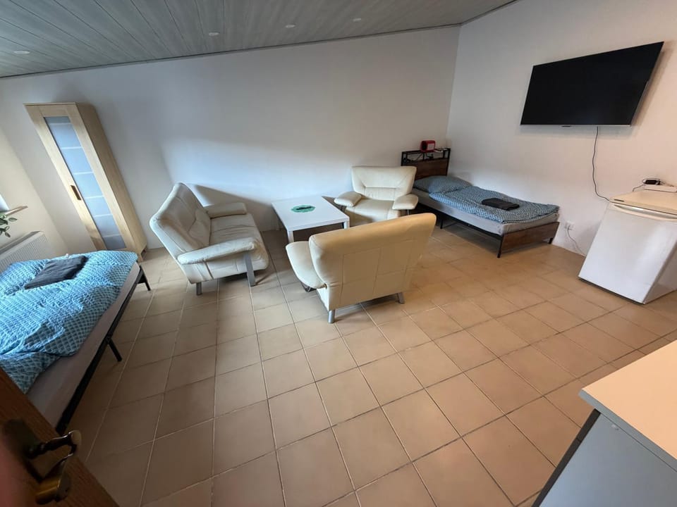 Bed, TV and multimedia, Living room, Seating area