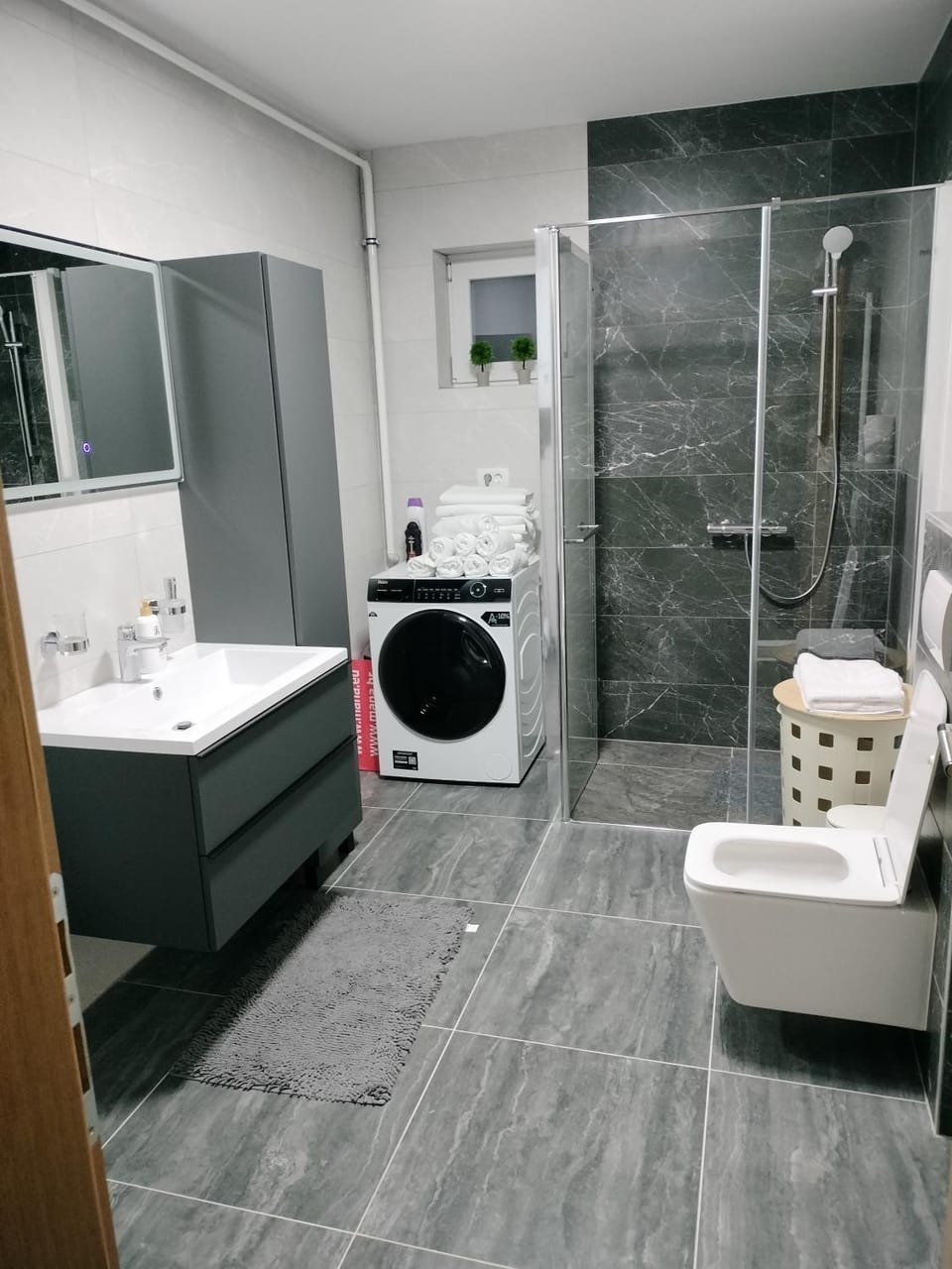 Shower, Toilet, Bathroom, towels, washing machine, dryer