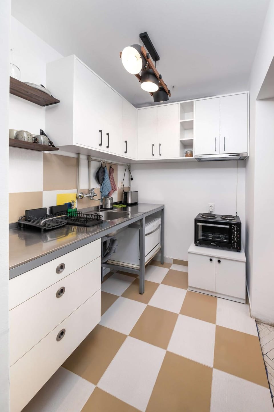 Kitchen or kitchenette, dishwasher, oven, stove, toaster