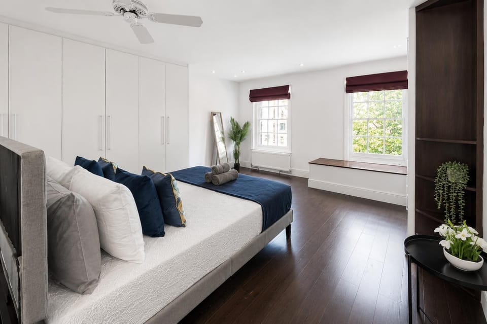 Bed, Bathroom, View (from property/room), Photo of the whole room, Decorative detail, Seating area, Bedroom, flat iron, hair dryier, towels, wardrobe