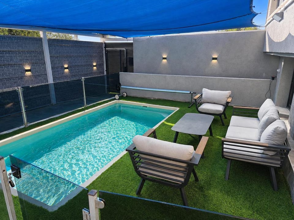 Patio, Seating area, Pool view, Swimming pool, sunbed