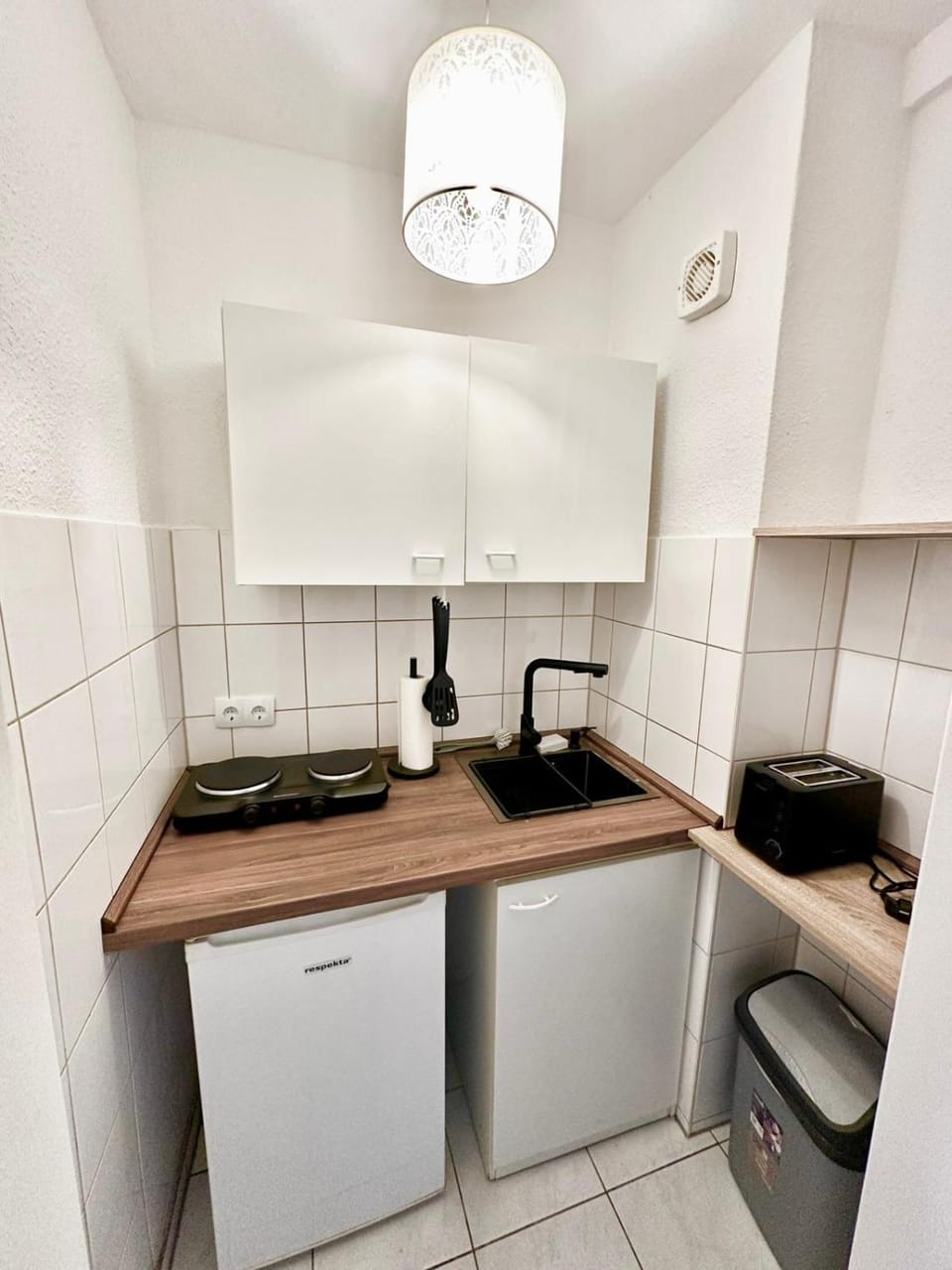 Kitchen or kitchenette, stove, toaster