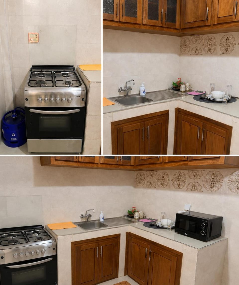 Kitchen or kitchenette, dishwasher, oven, stove, toaster, washing machine