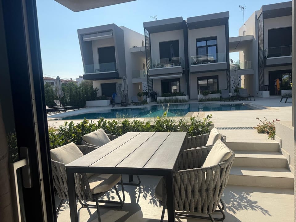 Property building, Seating area, Dining area, Pool view