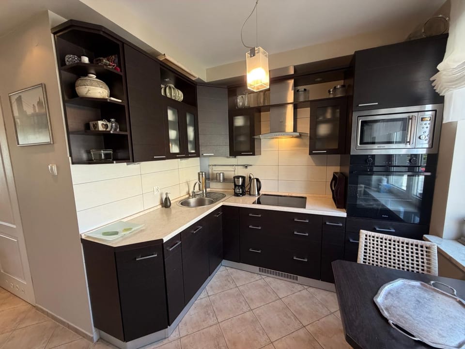 Kitchen or kitchenette, dishwasher, oven, stove, toaster