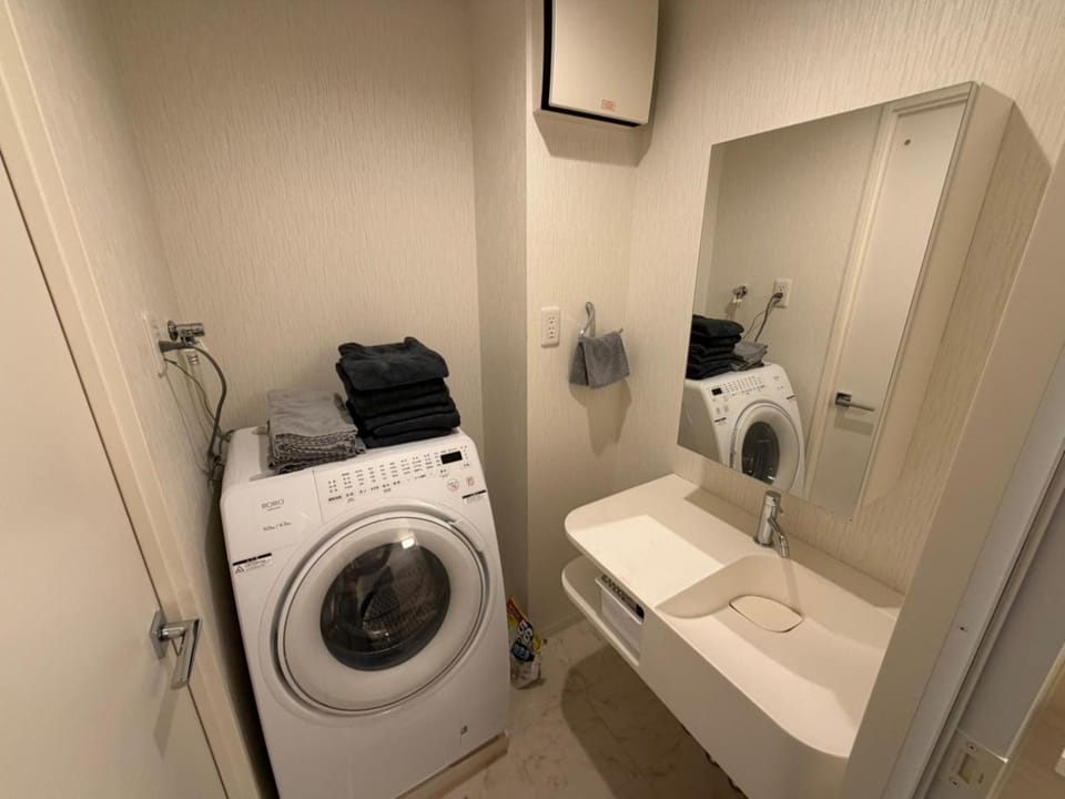 Bathroom, towels, washing machine, dryer