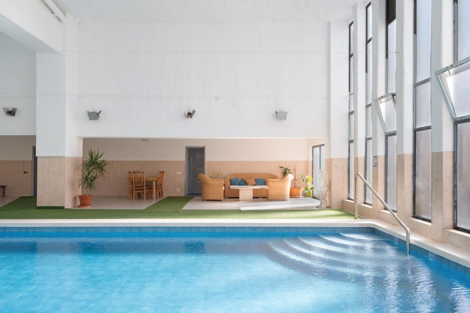 Property building, Living room, Swimming pool