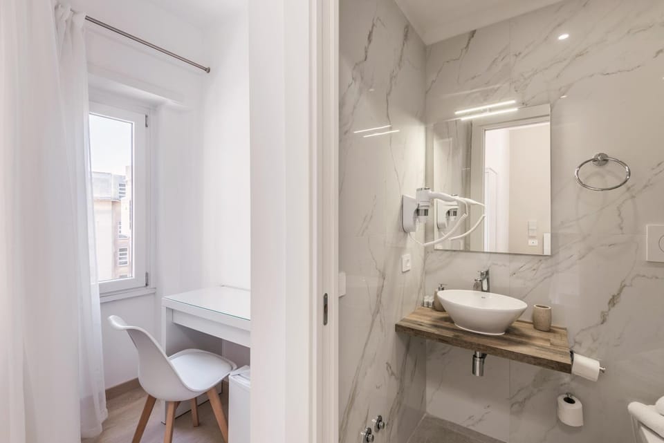 Shower, Toilet, Bathroom, hair dryier, towels