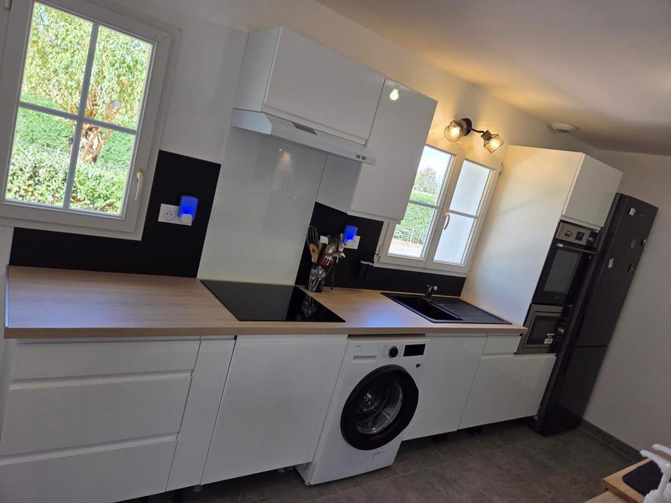 Kitchen or kitchenette, dishwasher, microwave, oven, stove, washing machine