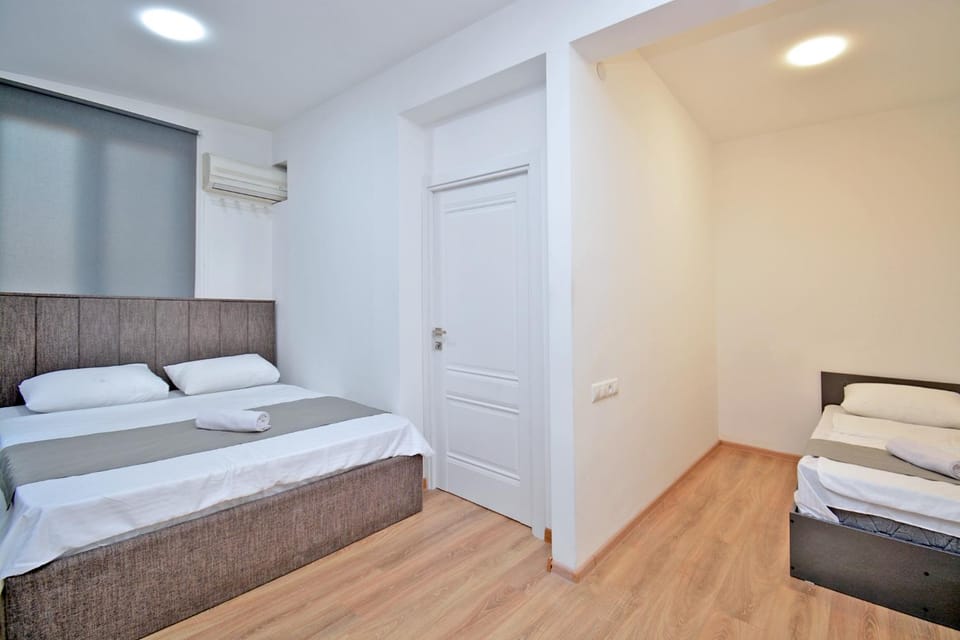 Bed, Living room, Photo of the whole room, Seating area, Bedroom, towels, wardrobe, air conditioner