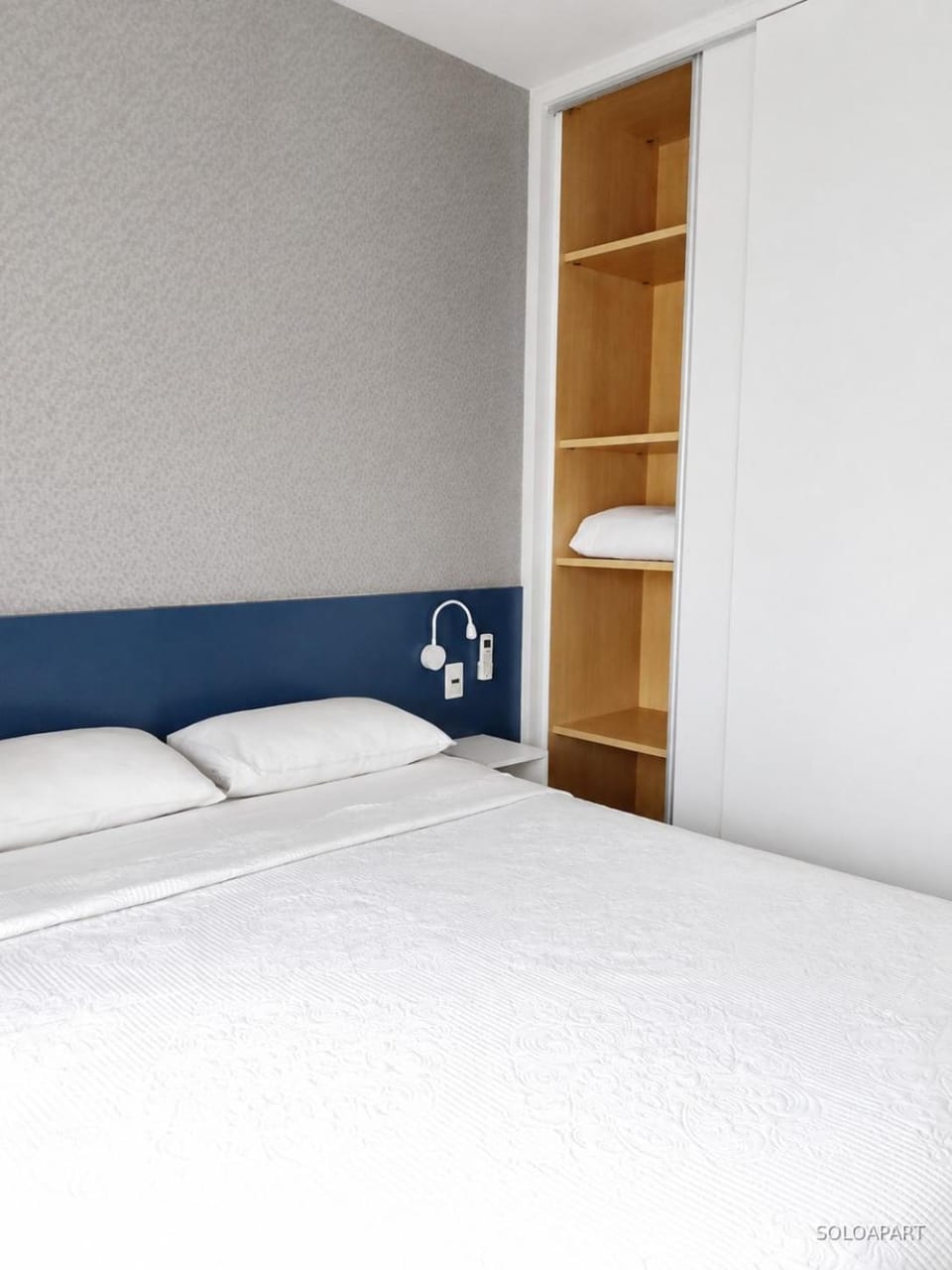 Bed, Bedroom, hair dryier, storage, towels, wardrobe, air conditioner