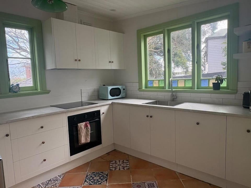 Kitchen or kitchenette, dishwasher, stove, toaster