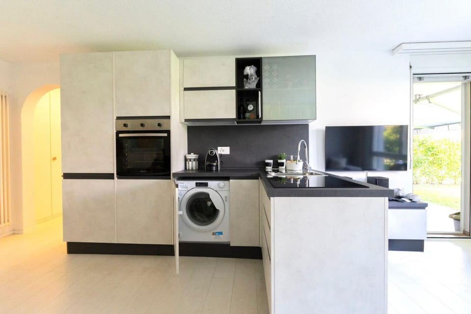 Kitchen or kitchenette, dishwasher, oven, stove, washing machine