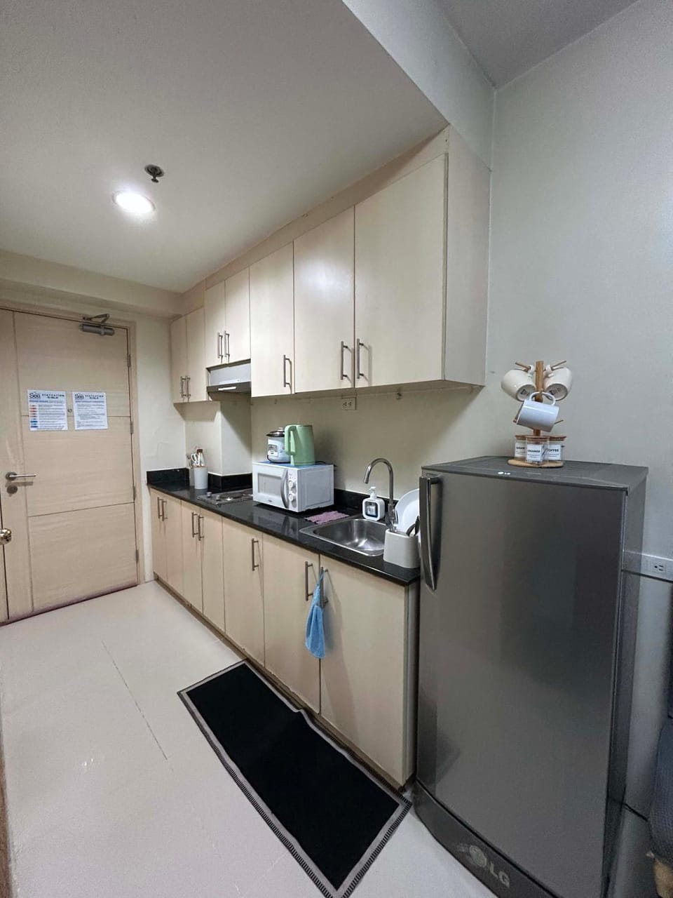 Kitchen or kitchenette, dishwasher, oven, stove