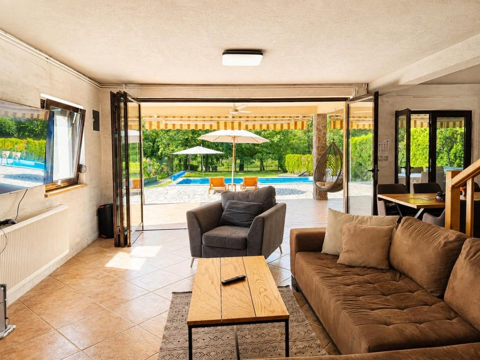 Patio, Balcony/Terrace, Living room, Seating area, Garden view, Pool view, Swimming pool