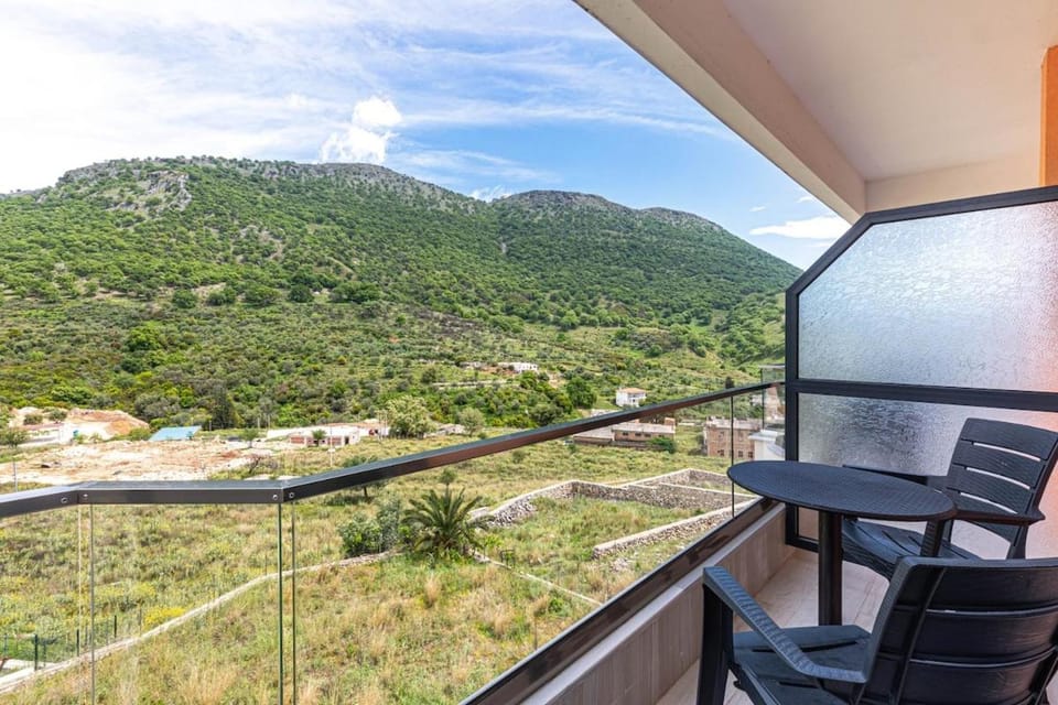 Property building, Natural landscape, View (from property/room), Balcony/Terrace, Seating area, Mountain view