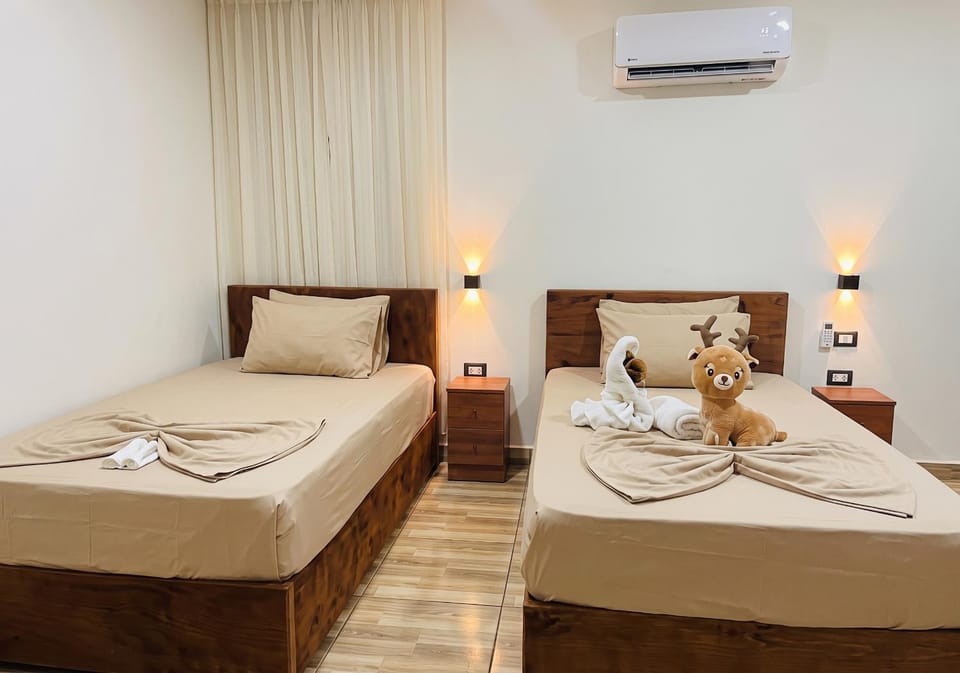 Bed, Photo of the whole room, Bedroom, towels, air conditioner