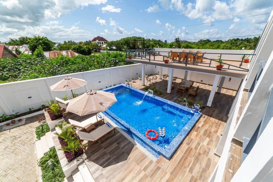 Entire Apt-7 Min Beachwalk - Full Kitchen & Pool Apartment in Tanzania
