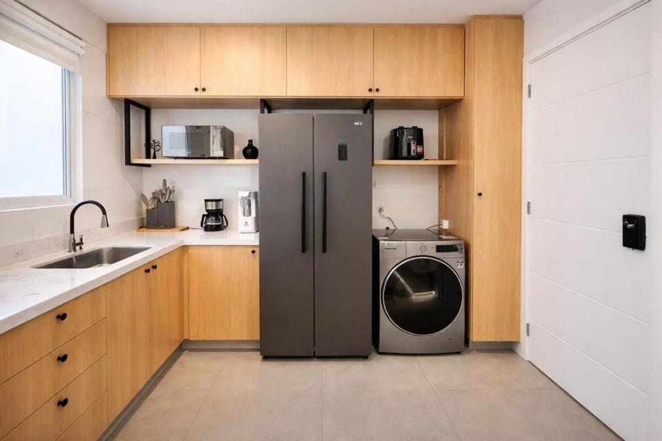 Kitchen or kitchenette, microwave, washing machine, dryer