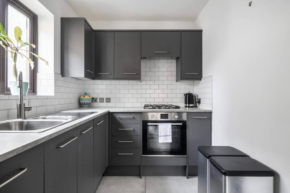 Kitchen or kitchenette, dishwasher, oven, stove, toaster