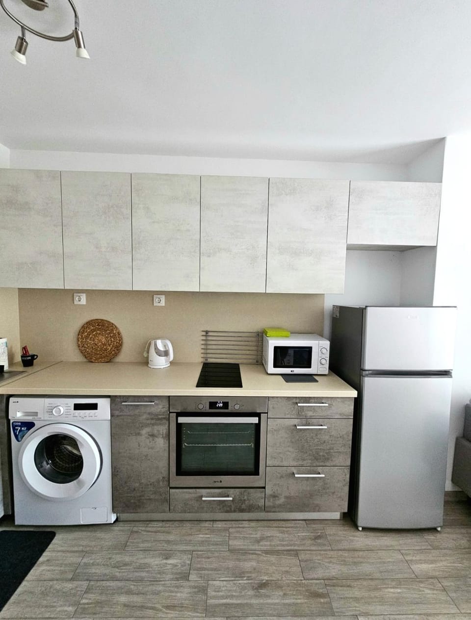 Kitchen or kitchenette, dishwasher, oven, stove, washing machine