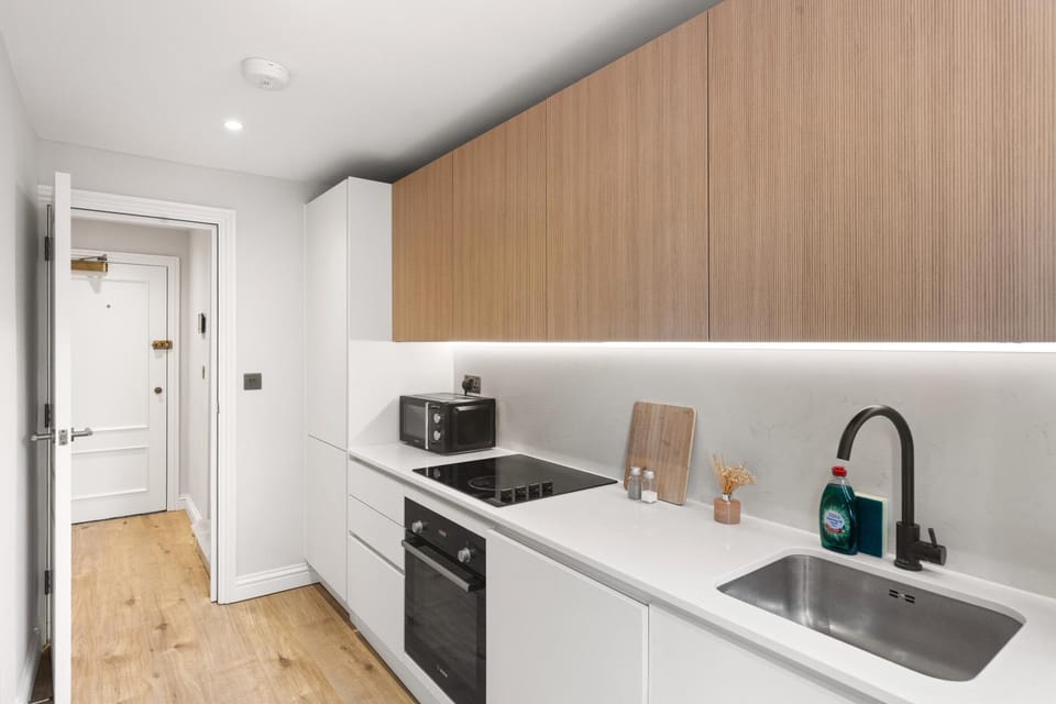 Kitchen or kitchenette, microwave, oven, stove