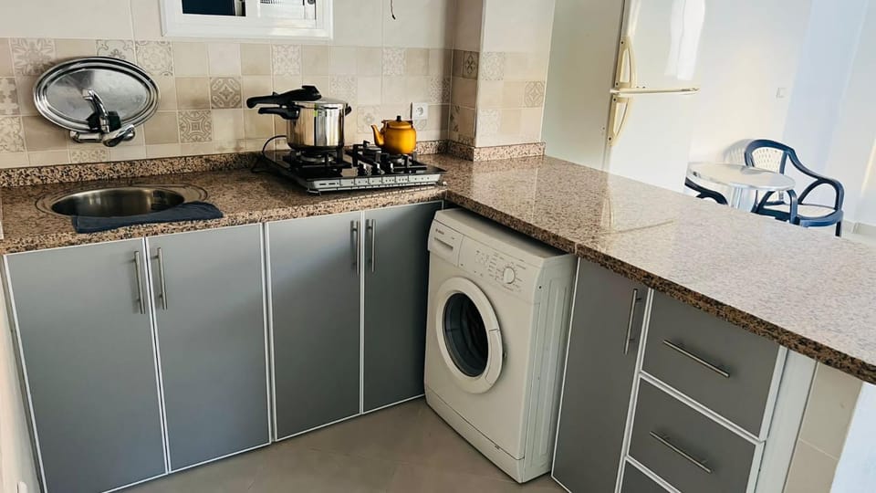 Kitchen or kitchenette, washing machine