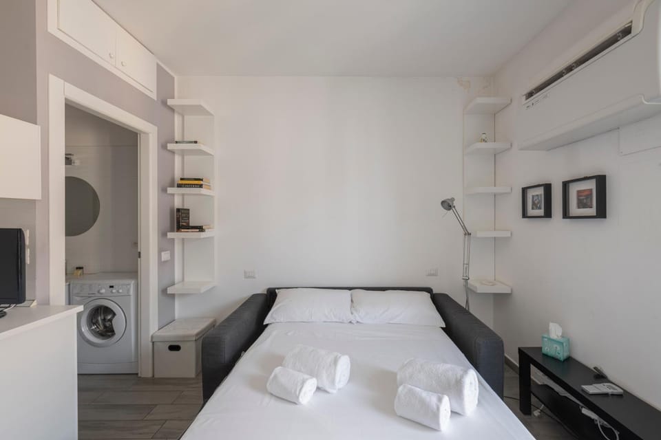 Bed, towels, washing machine, air conditioner