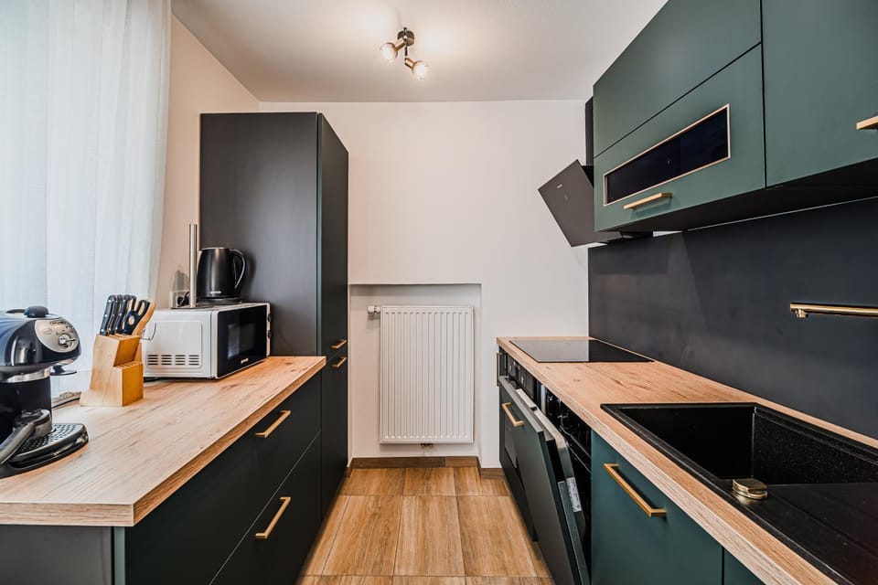 Kitchen or kitchenette, dishwasher, microwave, stove