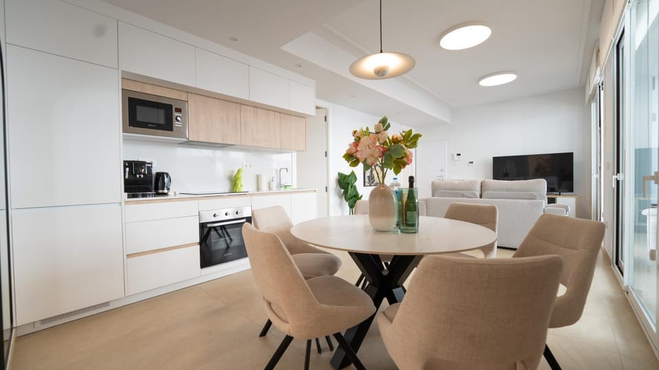 TV and multimedia, Kitchen or kitchenette, Living room, Seating area, Dining area, dishwasher, microwave, oven, stove, toaster, air conditioner