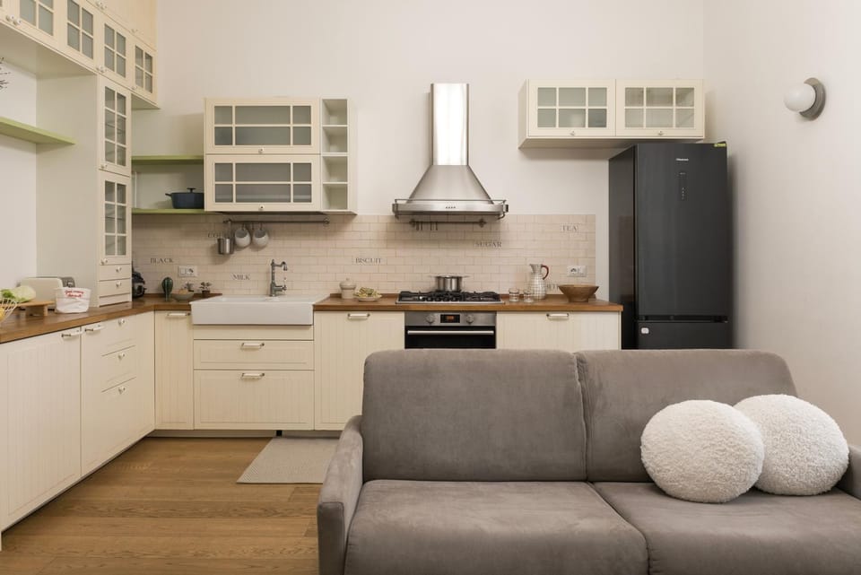 Kitchen or kitchenette, dishwasher, oven, stove